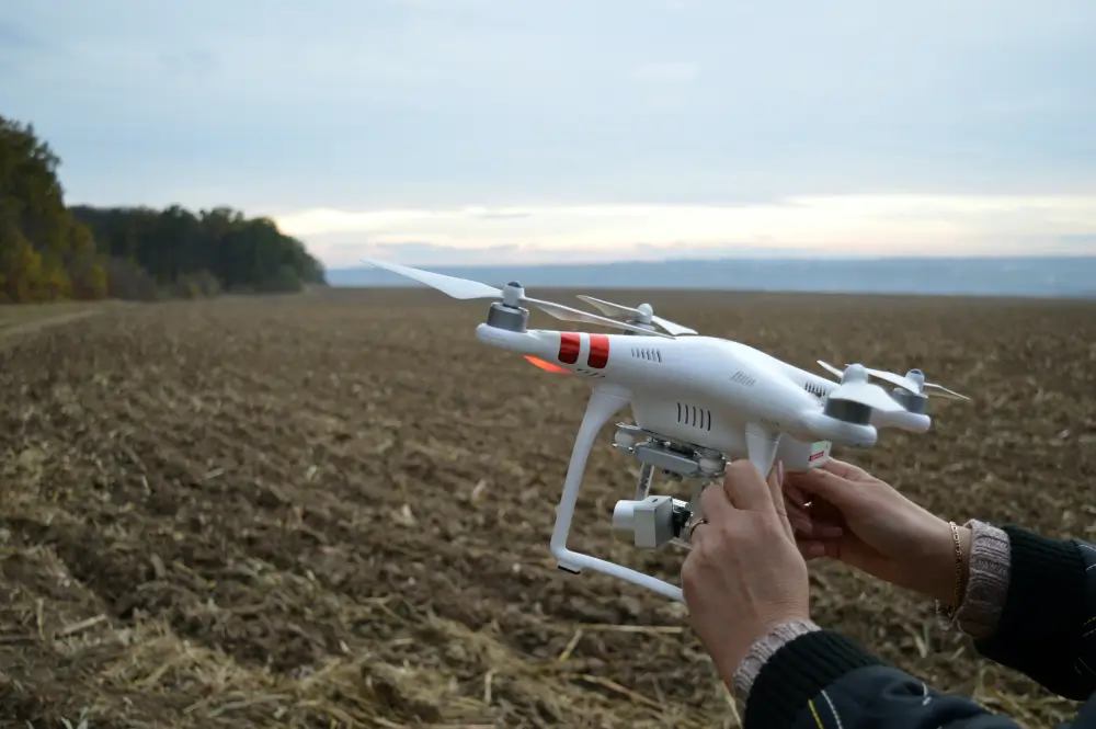 man-hold-ai-drones-at-farm